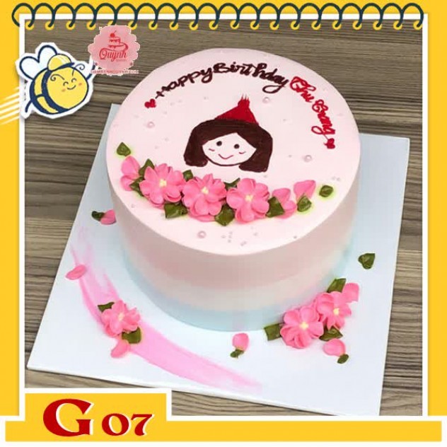 giới thiệu tổng quan Bánh kem bé gái G07 vẽ mặt bé gái kèm nhiều đóa hoa màu hồng xinh trên nền bánh màu hồng nhạt