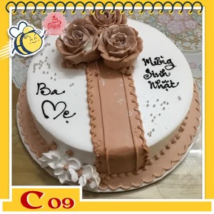 Bánh kem tặng cha C09 màu nâu trắng với đóa hoa tạo thành hình chiếc nơ ruy băng bằng hoa ấn tượng