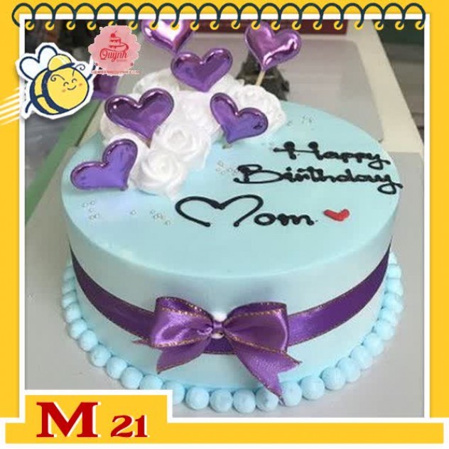 giới thiệu tổng quan Bánh kem tặng mẹ M21 nền xanh nhạ trang trí hoa trắng và phụ kiện màu tím phù hợp mẹ trung niên